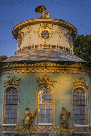 Chinese house in the evening light, tea house with golden sculptures, Sanssouci Park, Potsdam