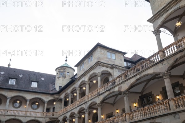 At Christmas time, the Old Palace in Stuttgart shines with festive poinsettias in the courtyard. The atmospheric lighting creates a romantic atmosphere and invites you to relax
