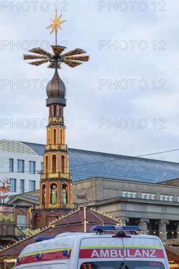 An ambulance is parked at the Stuttgart Christmas market to provide rapid medical assistance. The presence ensures safety and gives visitors peace of mind during the festival