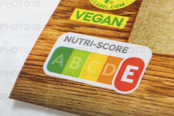 Food packaging with prominent Nutri-Score label and vegan sticker