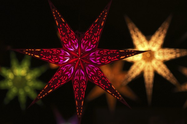 Colorful Christmas stars, sales stand, baroque Christmas market, blue hour, dusk, Ludwigsburg, Baden-Württemberg, Germany