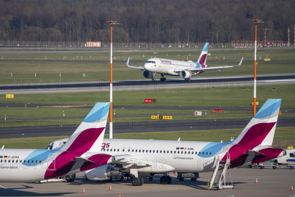 Eurowings aircraft, on field positions and on landing, Düsseldorf airport, DUS