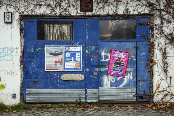 Old entrance gate covered with posters, Hanseatic City of Stralsund, Baltic Sea, Mecklenburg-Western Pomerania, East Germany, Germany