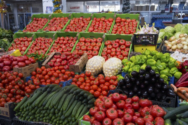 A large market stand full of tomatoes and fresh vegetables in green boxes, Akhaltsikhe market, Samtskhe-Javakheti region, Samtskhe-Javakheti, Georgia