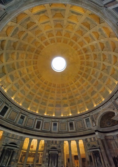 View of ancient building historic Roman temple Pantheon from bottom to top on coffered ceiling with Oculus 9 nine meter wide opening at the highest point highest point of Kuppe, Rome, Lazio, Italy