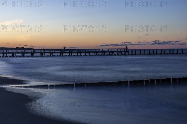 Groves and wooden walkway in the sea, sunset, long exposure, Zingst, Fischland-Darß-Zingst, Western Pomerania Lagoon Area National Park, Mecklenburg-Western Pomerania, Germany