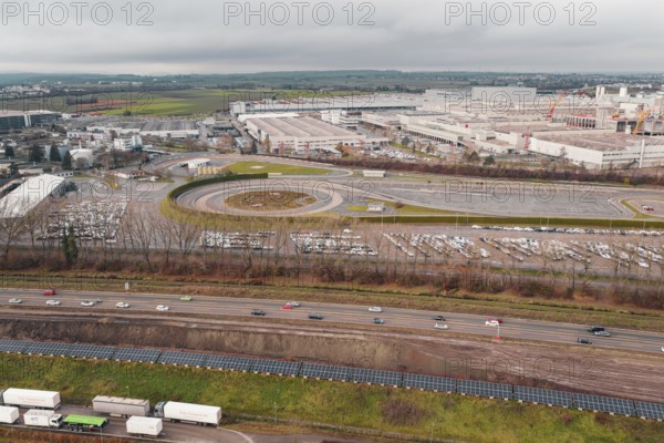 Extensive Daimler Benz industrial area with roads and parking lots under a cloudy sky, Böblingen, Germany