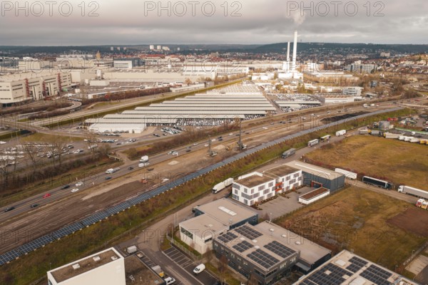 Industrial area with chimneys and factory buildings under a cloudy sky, A81, Böblingen, Germany