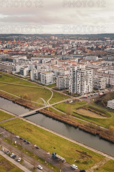 Large residential complex with modern buildings on a canal and adjacent green spaces, Böblingen, Germany