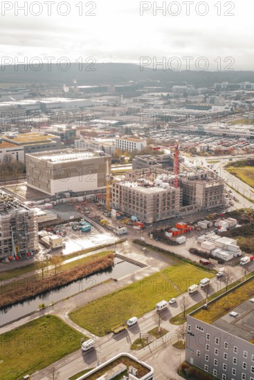 New hospital building Municipal construction site with several buildings and cranes next to green areas, Böblingen, Germany