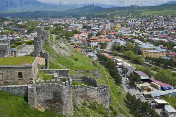 Panorama of a city with historic castle ruins on a hill under cloudy sky, Rabati Fortress, Akhaltsikhe, Samtskhe-Javakheti region, Samtskhe-Javakheti, Georgia