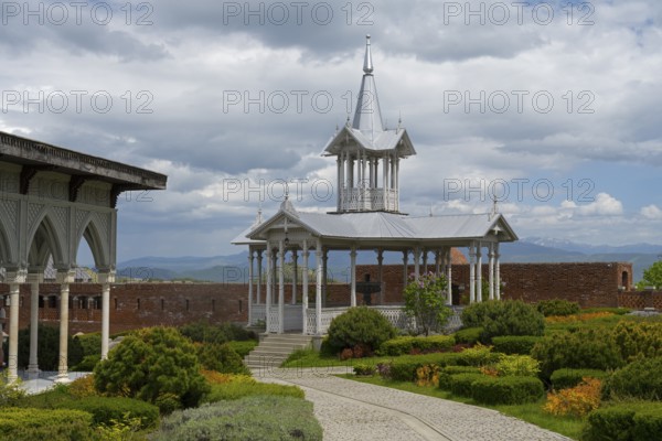 Elegant white pavilion in a well-kept garden with a curved path and mountain views, Rabati Fortress, Akhaltsikhe, Samtskhe-Javakheti region, Samtskhe-Javakheti, Georgia