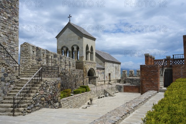 Stone complex with stairs, a church entrance and an open courtyard under cloudy sky, Rabati Fortress, Akhaltsikhe, Samtskhe-Javakheti region, Samtskhe-Javakheti, Georgia