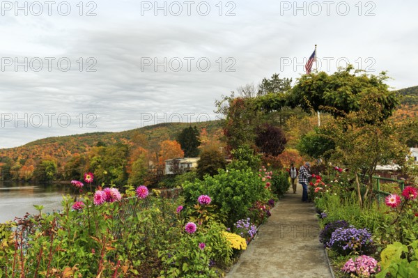 Flower bridge, Bridge of Flowers, bridge over Deerfield River, gardens, riverscape, walkers, autumn leaves, Indian summer, Mohawk Trail panoramic road, former trade route, Shelburne Falls, Massachusetts, New England, USA