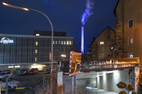 Glowing blue chimney from the CHP plant in the evening, Erlangen.Mittelfranken, Bavaria, Germany