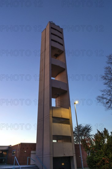 Bell tower of Nicodemus Church in the evening, Röthenbach near Schweinau district, Nuremberg, Middle Franconia, Bavaria, Germany