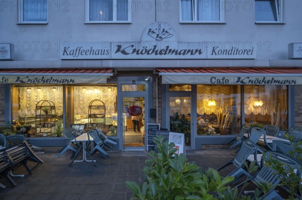 Nostalgic café lit in the evening, opened in 1968, Röthenbach near Schweinau district, Nuremberg, Middle Franconia, Bavaria, Germany