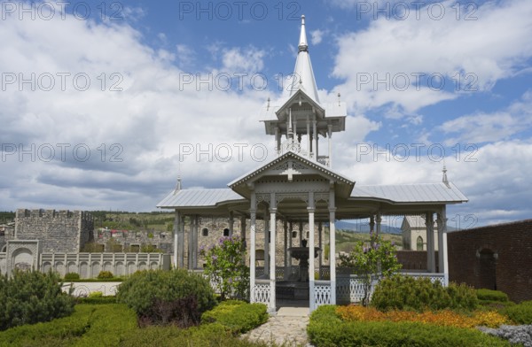 White wooden pavilion in a well-kept garden under a cloudy sky, Rabati Fortress, Akhaltsikhe, Samtskhe-Javakheti region, Samtskhe-Javakheti, Georgia