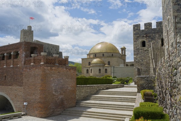 Historical building with golden dome and massive stone walls under cloudy sky, Rabati Fortress, Akhaltsikhe, Samtskhe-Javakheti region, Samtskhe-Javakheti, Georgia