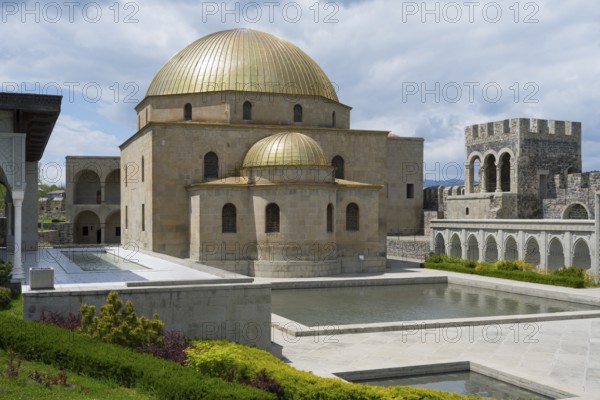 Buildings with golden dome and stone arcades next to water basins under blue sky, Rabati Fortress, Akhaltsikhe, Samtskhe-Javakheti region, Samtskhe-Javakheti, Georgia