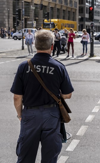 Judicial staff waiting at a pedestrian traffic light, Berlin, Germany