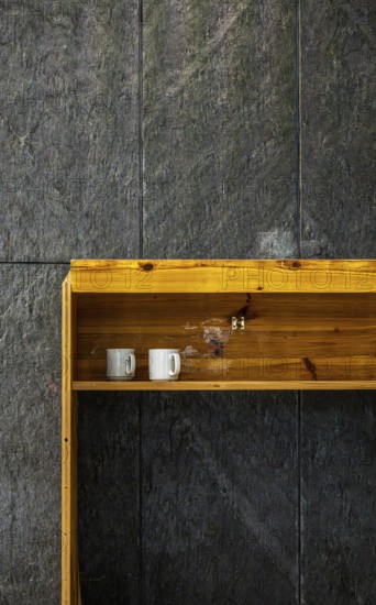 Temporary wooden rack with empty coffee cups on an interior construction site, Berlin, Germany