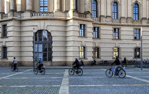 Cyclists on Friedrich-Ebert-Platz in Berlin Mitte, Germany