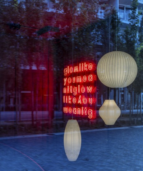 Ceiling lights, looking through the shop window into the interior of a furniture store, Berlin, Germany