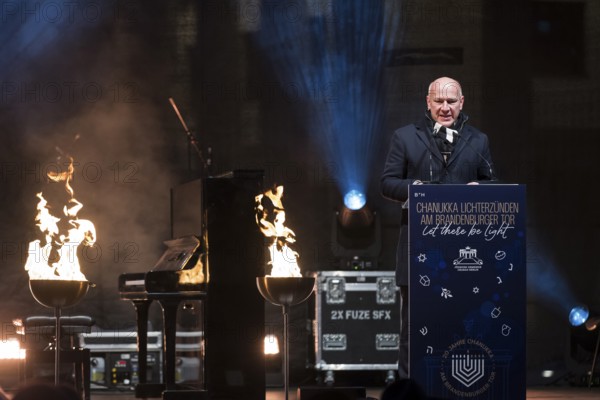 Kai Wegner (Governing Mayor of Berlin) speaks at the lighting of lights to mark 20 years of Hanukkah in front of the Brandenburg Gate, Berlin, 17 December 2025