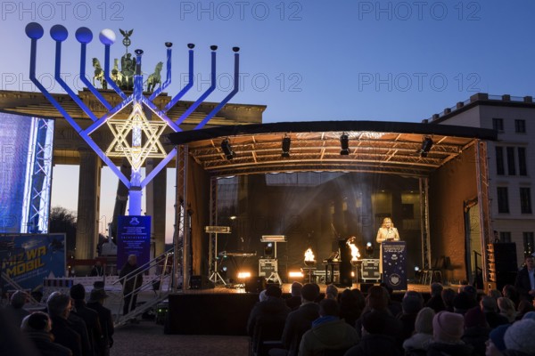 Julia Klöckner (President of the German Bundestag) speaks at the lighting of lights to mark 20 years of Hanukkah in front of the Brandenburg Tor, Berlin, 17 December 2025