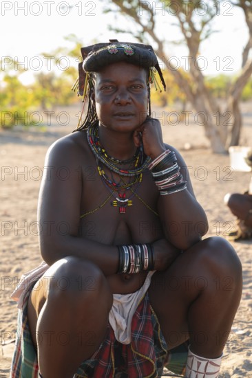 Portrait, brightly decorated woman of the Hakaona tribe, also Havakona or Hakawona, near Opuwo, Kunene, Namibia