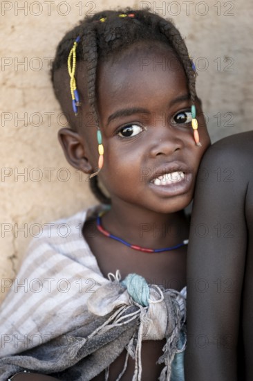 Portrait, brightly decorated girl of the Hakaona tribe, also Havakona or Hakawona, near Opuwo, Kunene, Namibia