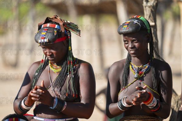 Traditional dance, brightly decorated woman of the Hakaona tribe, also Havakona or Hakawona, near Opuwo, Kunene, Namibia