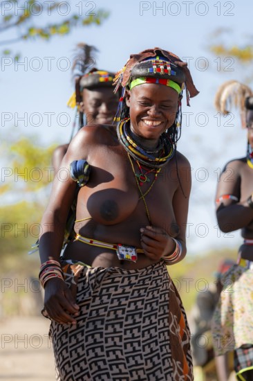 Traditional dance, brightly decorated woman of the Hakaona tribe, also Havakona or Hakawona, near Opuwo, Kunene, Namibia
