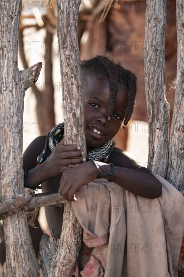 Portrait, young Himba child, traditional Himba village, Kaokoveld, Kunene, Namibia