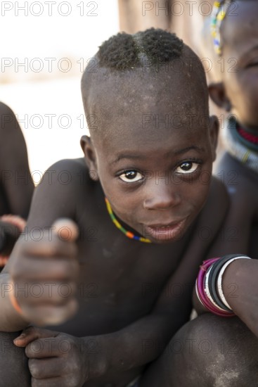 Portrait, curious Himba child, traditional Himba village, Kaokoveld, Kunene, Namibia