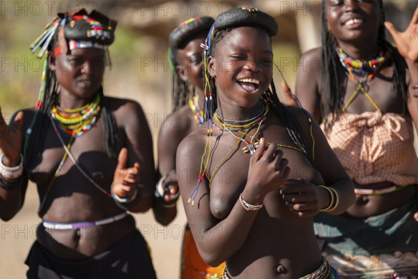 Traditional dance, brightly decorated woman of the Hakaona tribe, also Havakona or Hakawona, near Opuwo, Kunene, Namibia