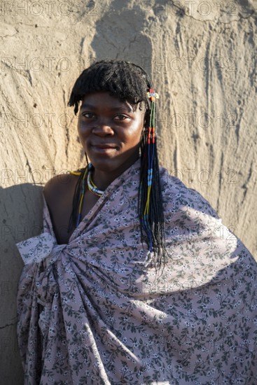 Portrait, brightly decorated woman of the Hakaona tribe, also Havakona or Hakawona, near Opuwo, Kunene, Namibia