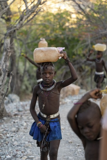 Himba child fetches water, carries canisters, traditional Himba, Kaokoveld, Kunene, Namibia