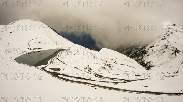 Another onset of winter in May, Riezler Alpsee, an artificially created lake, snow pond, feeds the snow cannons that completely snow the slopes of the Fellhorn and Kanzelwand cable cars, Allgäu Alps, Vorarlberg, Austria