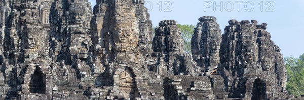 Panoramic picture of huge stone-carved faces of Bodhisattva Lokeshvara, also Avalokiteshvara, Bayon Temple, Angkor Thom, UNESCO World Heritage Site, Angkor Wat, Siem Reap, Cambodia