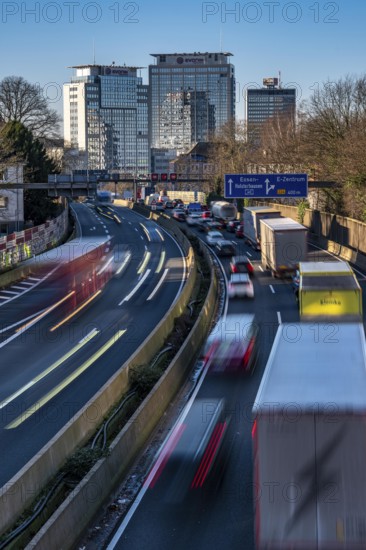 The A40 motorway, Ruhrschnellweg, in Essen, city skyline, Evonik office building, traffic jam in the westbound lane, Duisburg, slow traffic, North Rhine-Westphalia, Germany