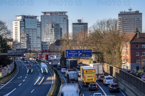 The A40 motorway, Ruhrschnellweg, in Essen, city skyline, Evonik office building, traffic jam in the westbound lane, Duisburg, slow traffic, North Rhine-Westphalia, Germany