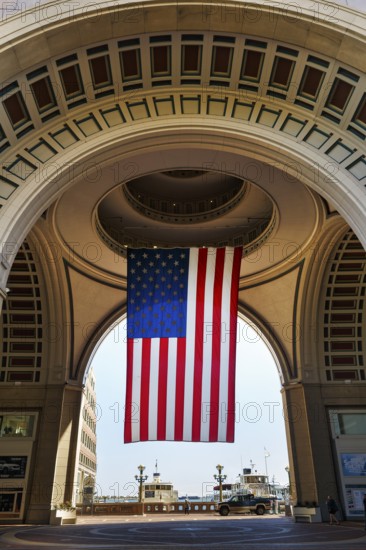 American flag fluttering, distinctive archway, Boston Harbor Hotel, Rowes Wharf, Freedom Trail, Financial District, Downtown, Boston, Massachusetts, New England, USA