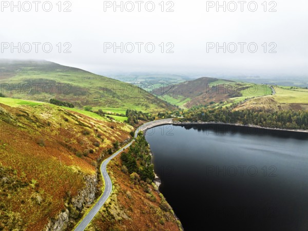 Autumn colours over Llyn Clywedog and Clywedog Reservoir from a drone, Llanidloes, Wales, UK