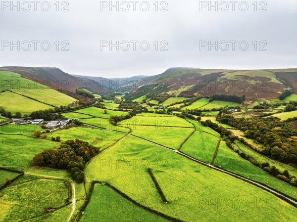Autumn colours of Farms over River Wye and Road A470 from a drone, Llanidloes, Powys, Montgomeryshire, Wales, UK