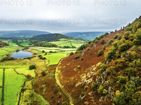 Autumn Colours over Gwynllyn Lake and Stream Nantgwynllyn from a drone, Rhayader, Powys, Radnorshire, Wales, UK
