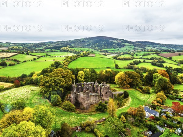 Autumn Colours over ruins of Grosmont Castle from a drone, Grosmont, Monmouthshire, Wales, UK