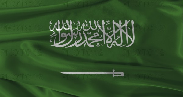 Flag of Saudi Arabia with fabric textured background. Close up of National flag of Saudi Arabia with realistic texture