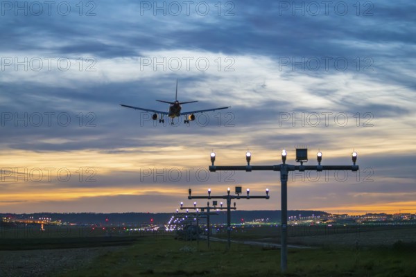 Arrival over brightly lit runway at dusk, Stuttgart Airport, Leinfelden-Echterdingen, Baden-Württemberg, Germany